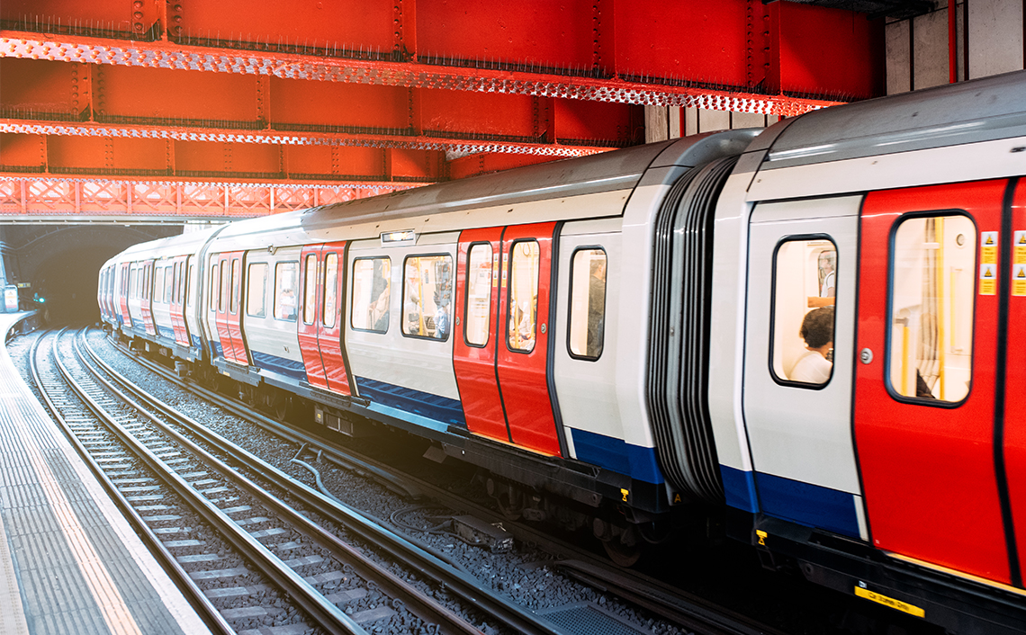 A train travelling under a bridge