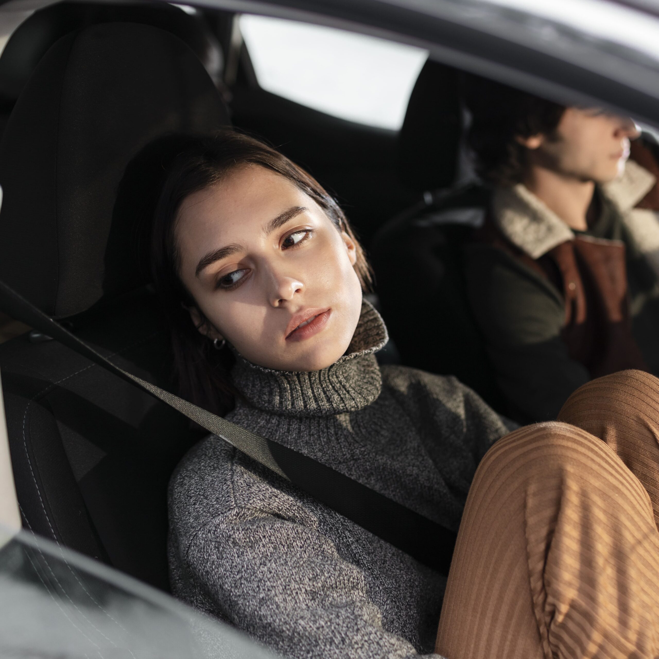 Close up view of friends travelling by car